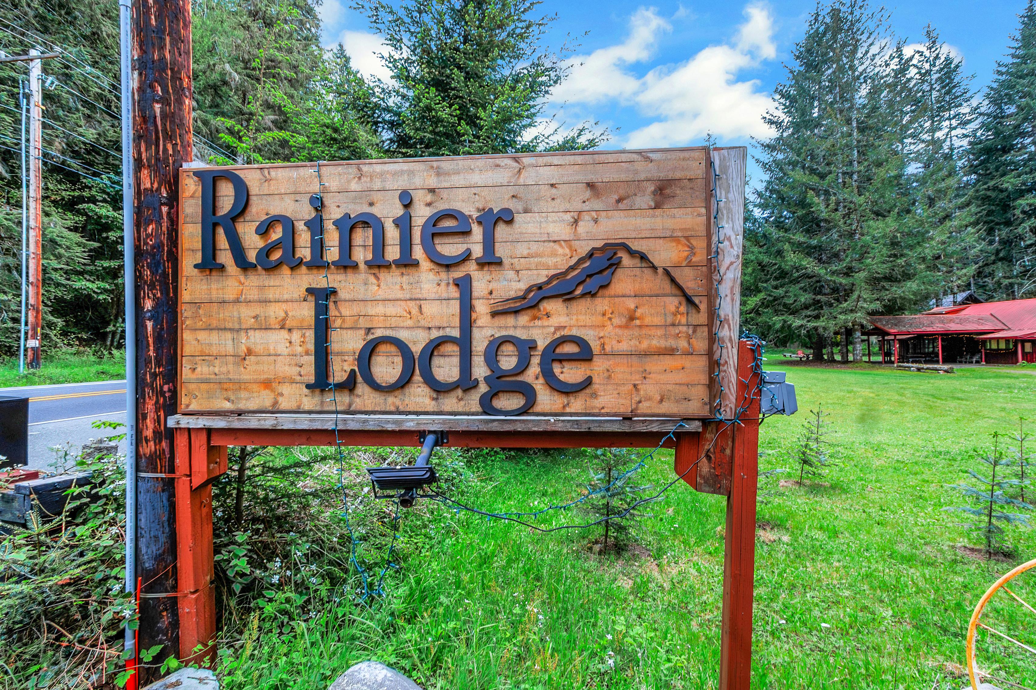 Rainier Lodge Log Cabin exterior surrounded by forest