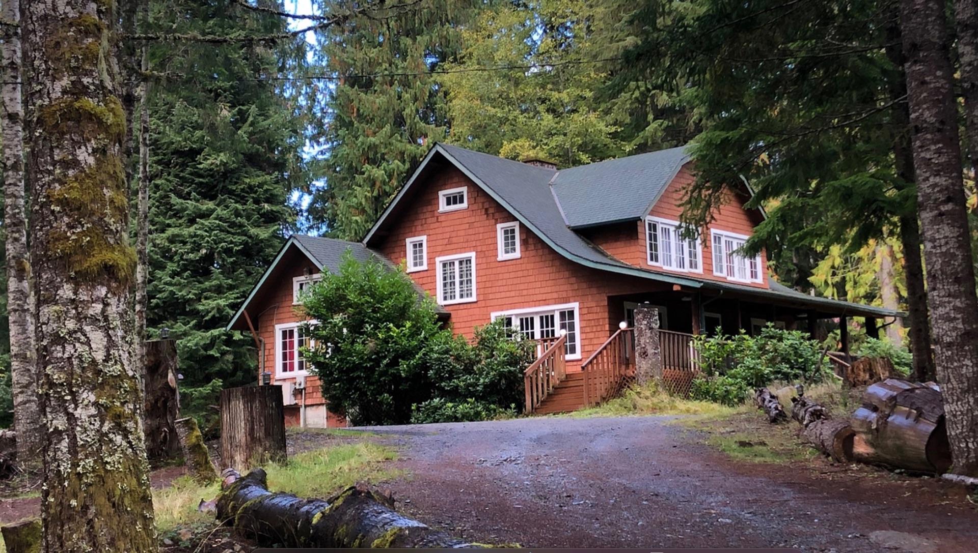 Rainier Lodge main building surrounded by evergreen forest